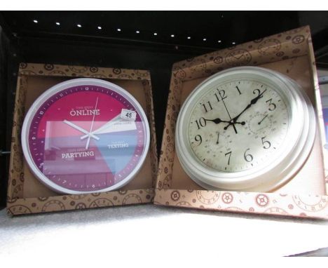 A new and boxed student wall clock and one other.
