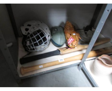 A cricket bat 'clock' a/f, a baseball bat, helmet and mitts.