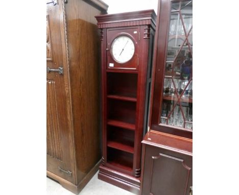 A modern Grandfather clock/book case.