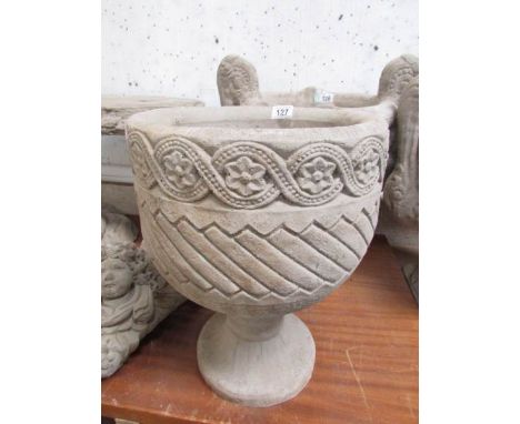 A Mayan circular urn with Aztec design.