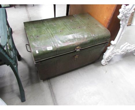 A large old tin trunk.