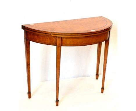 A George III Satinwood, Tulipwood and Ebony Strung Foldover Card Table, circa 1800, with baize lined interior above square ta