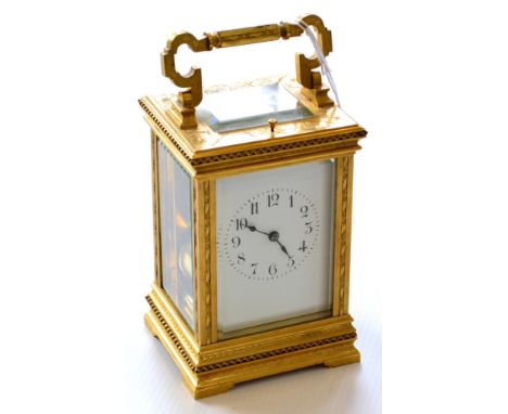A Gilt Brass Striking and Repeating Carriage Clock, circa 1900, engraved case with carrying handle and repeat button, enamel 