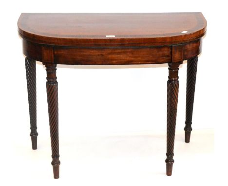 An Early 19th Century Mahogany and Rosewood Crossbanded Card Table, of D shaped form, with green baize lined interior, raised