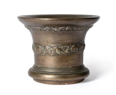 A 17th Century Bronze Mortar, possibly Whitechapel, London, inverted bell shaped with a band of scroll and shell decoration b