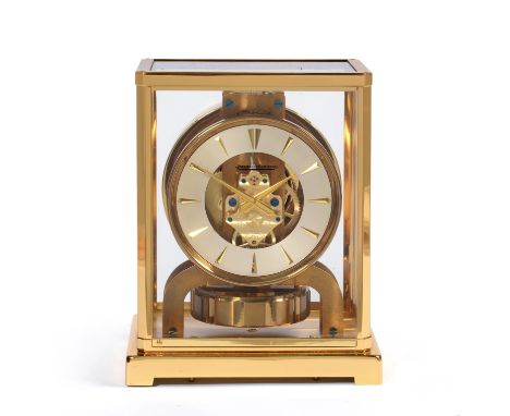 An Atmos Clock, signed Jaeger LeCoultre, 20th century, glazed panels, front opening door, 4-1/4-inch silvered dial with appli