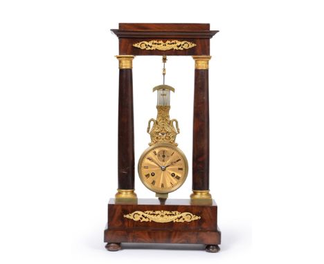 An Unusual Mahogany and Gilt Metal Mounted Oscillating Movement Portico Striking Mantel Clock, 19th century, applied gilt met