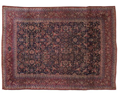 Unusual Mashad Carpet North East Persia The deep indigo allover lattice vine field of palmettes and flowers enclosed by raspb