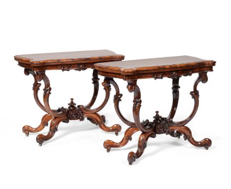 A Pair of Early Victorian Rosewood Serpentine Shaped Card Tables, mid 19th century, with hinged lids enclosing velvet lined i