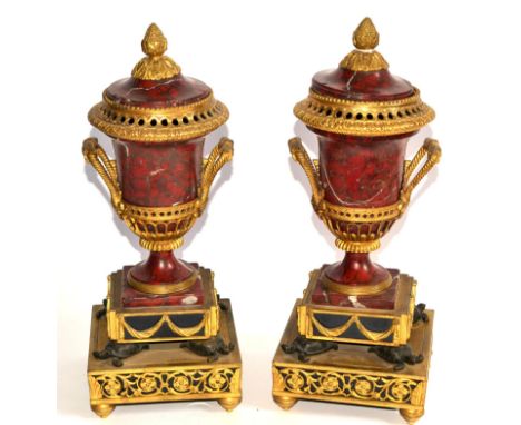 A Pair of French Ormolu and Rouge Marble Urns and Covers, 1st half 19th century, with pineapple cast finials with stiff leaf 
