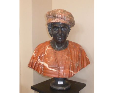 A Carved Marble Pedestal Bust of a Merchant, 20th century, composed of three different types of marble, the figure gazing for