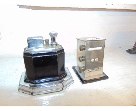 A silver plated table lighter and desk calender