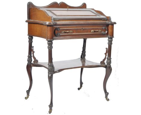 An antique 19th Century Continental mahogany ladies bonheur de jour writing table desk having a shaped gallery back with step