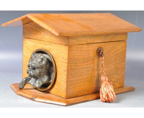 A charming antique 19th Century Victorian wooden novelty tea caddy in the form of a dog kennel having an arched lid with spel