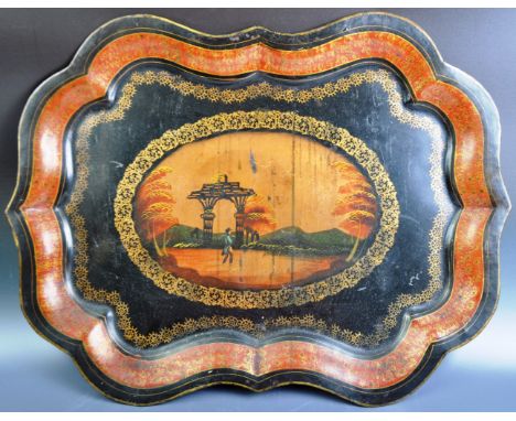 An early 19th Century Georgian Regency period Pontypool metal tray of scalloped form - likely a Wolverhampton maker with cent