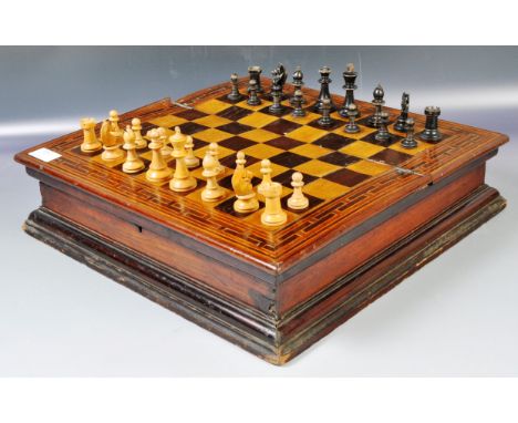 An antique 19th Century Victorian specimen wood&nbsp;games compendium box / chess board having a three quarter hinged lidded 