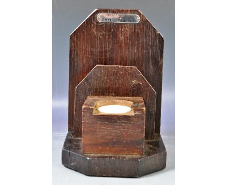 An early 20th Century teak bookend / inkwell in the form of a commode. Made from the teak of HMS Spartiate. Ceramic inkwell h