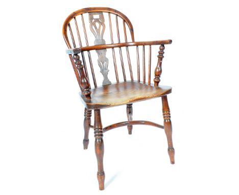 An antique early 19th Century Georgian English Country Farmhouse Windsor armchair / elbow / fireside chair of yew and elm woo