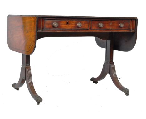 An antique early 19th Century Georgian Regency period English&nbsp;mahogany sofa table writing table desk having a good grain