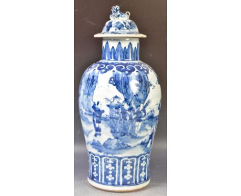 A large antique 19th Century Chinese Qing Dynasty Oriental blue and white porcelain temple jar and cover of tall form. The li