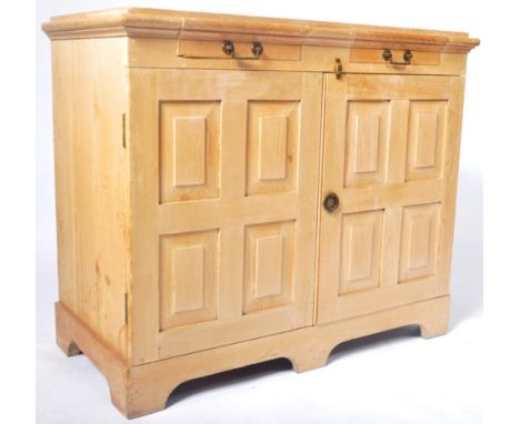 An antique 19th Century Irish pine specimen cabinet chest having two small shallow drawers to the top with twin quad fielded 