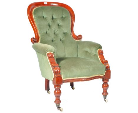 An antique 19th Century Victorian English mahogany spoon back armchair / low easy lounge chair having a mahogany wood frame w