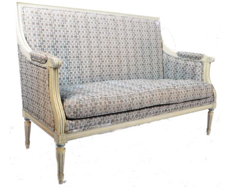 An antique 19th Century French salon suite two seater sofa settee canape having a white painted show wood frame with blue hig