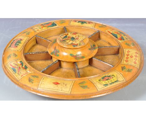 An antique early 19th Century Georgian Regency period turned treen boxwood Pope Joan card game gaming wheel of circular form 