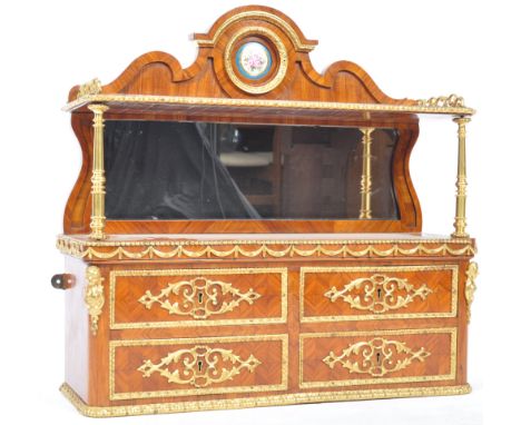 A 19th Century French antique Napoleonic kingwood and ormolu cabinet having an arched pediment gallery back with ormolu and S