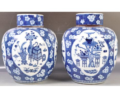 A large and impressive pair of antique 19th Century Chinese Qing Dynasty Kangxi mark (1661-1722) Oriental blue and white prun