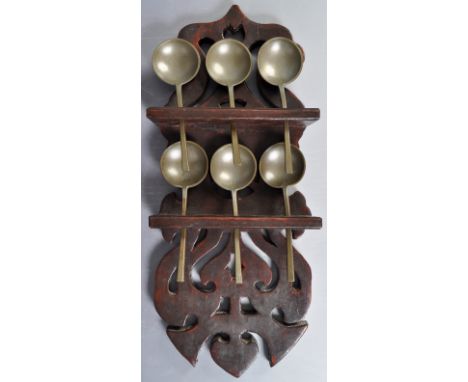 An antique early 19th Century Dutch carved pine / oak wall hanging spoon rack having. The ornate carved example with pierced 
