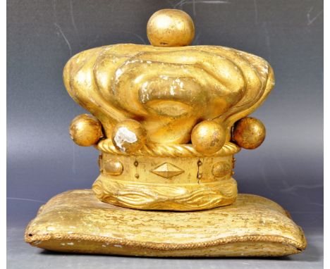 An antique early 20th Century Edwardian gilt painted gesso on wood can carved and modelled depicting of a crown on cushion. B