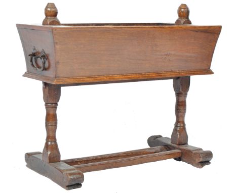 An antique 18th Century Georgian English oak planter /&nbsp;jardiniere plant stand having a tapering sarcophagus planter top 