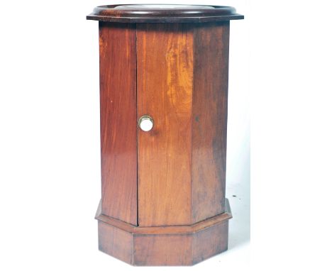 An antique 19th Century Victorian mahogany pot cupboard / cabinet or bust stand of octagonal form having an inset circular pa