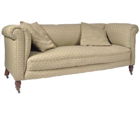 An antique 19th Century Victorian Chesterfield drop arm sofa settee in the manner of Howard &amp; Sons. The sofa having a stu