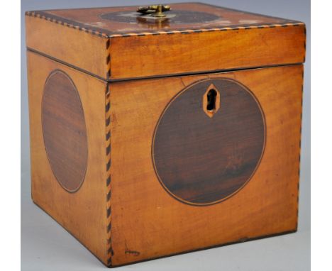 An 18th Century Georgian English antique Sheraton manner satinwood and rosewood tea caddy box. The box of square form with ch