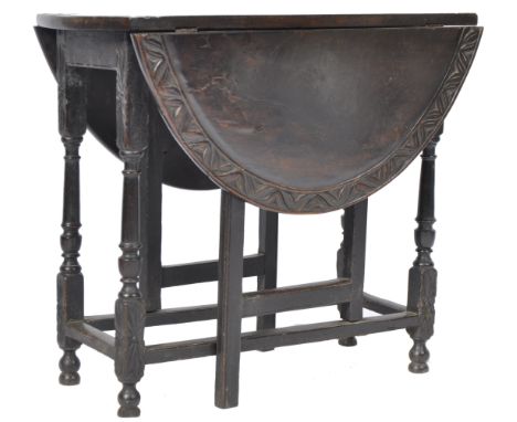 John Murphy - An antique 18th Century Georgian English heavily carved oak gate leg drop leaf table having a carved oak oval t