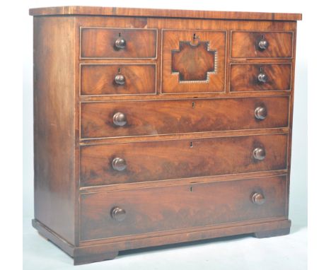 An antique 19th Century Irish mahogany chest of drawers with hat box. The bank of drawers having a central hat box to the top