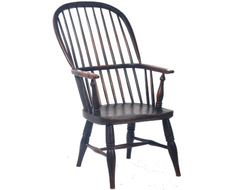 A charming antique 19th Century Georgian English Country oak and elm Windsor armchair / elbow chair having a shaped comb back