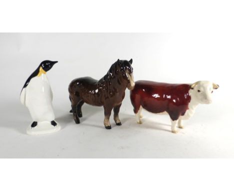 A Beswick figure modelled as a Hereford cow 'Champion of Champions, h. 10 cm, together with a Beswick pony and a Poole pengui