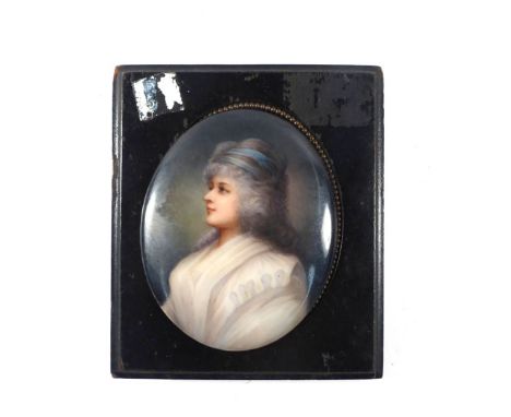 A 19th century miniature watercolour on porcelain head and shoulders portrait of Mrs Bridgwater within an ebonised frame, 11.