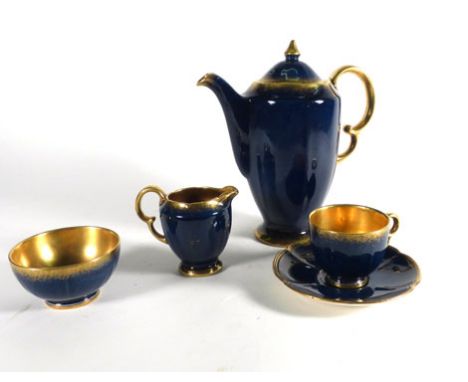 A Crown Devon six sitting tea service decorated in a plain mottled blue and gilt highlighted glaze