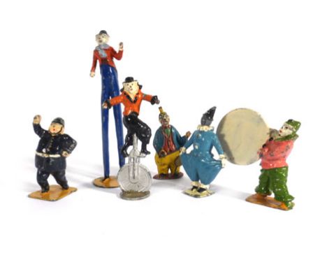 A mixed group of Charbens and other lead and cast metal circus figures including clowns, stilt walkers, unicyclist's and othe