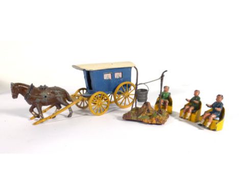 A mixed group of Charbens and other lead and cast metal gypsy encampment figures and accessories including a washing line, wa