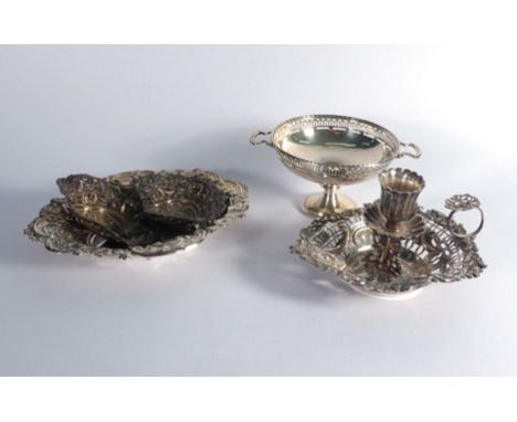 A Victorian pierced silver chamber stick, a miniature silver tazza and a stamped silver dish of oval form, various dates and 