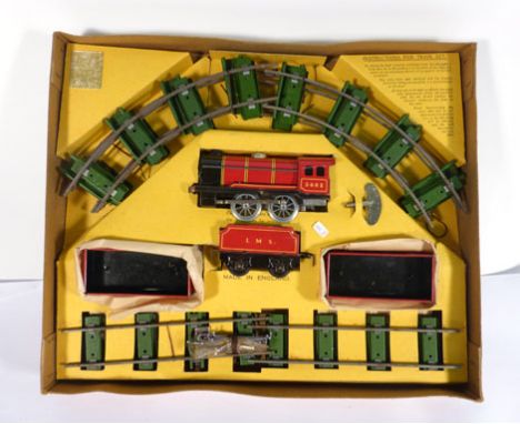 A Chad Valley tinplate clockwork train set consisting engine, tender, two wagons and track, boxed   CONDITION REPORT:  Typica