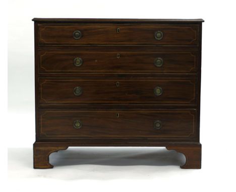 A George IV mahogany and strung chest of four graduated drawers, the top drawer opening to reveal a fitted interior with a fo