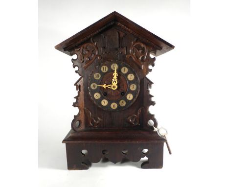 A late 19th/early 20th century Black Forest mantle cuckoo clock, striking on a gong, in the form of a chalet, h. 44 cm