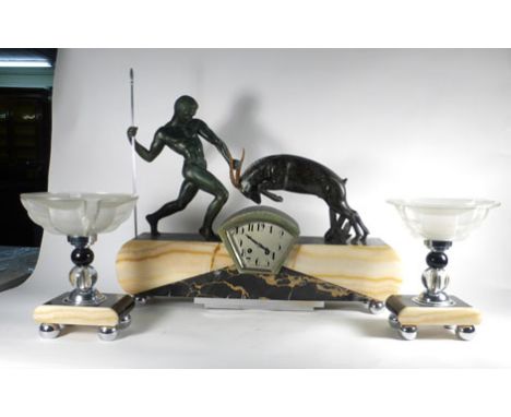 A 1930's Art Deco clock and garnitures, the marble and chromed case surmounted by a warrior with spear holding an gazelle, h.