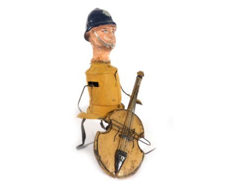 An unusual clockwork figure modelled as a policeman playing the cello, h. 21 cm   CONDITION REPORT:  Poor condition. Working 